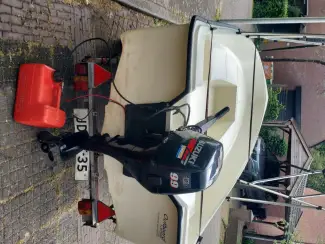 Sloepen sloep met trailer motor biminitop